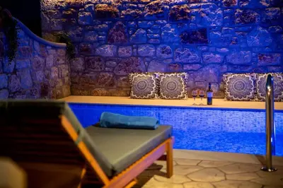 a bench in a room with a blue wall at Moana House in Sálakos