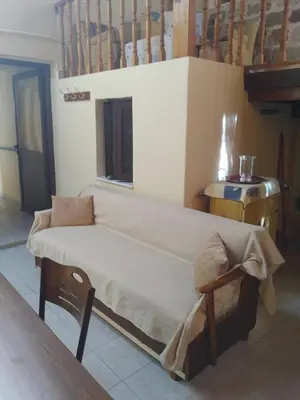 a large bed in a room with a table at House of dreams in Rhodes Town