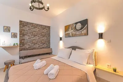 a bedroom with a large bed with two towels on it at Knights Golden Loch - Rhodes Unique Getaway in Rhodes Town