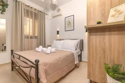 a bedroom with a bed with two towels on it at Knights Golden Loch - Rhodes Unique Getaway in Rhodes Town