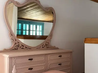 a dresser with a mirror on top of it at Casa Piaduli in Faliraki