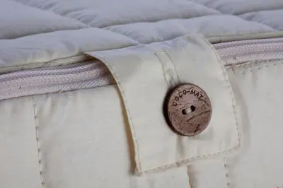 a button on the side of a bed at THALASSA in Livadia