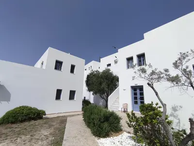 a white building with trees in front of it at THALASSA in Livadia