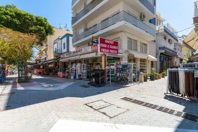 a street with a store on the side of a building at Urban Escape in Rhodes Town