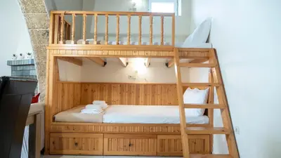 a bunk bed in a room with a bunk bed in a room at Beaver's Nest in Profília