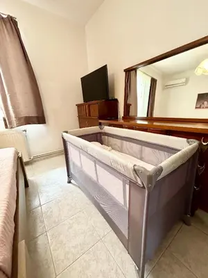 a bedroom with a bed with a mirror and a tub at Philoxenia House in Asklipio in Asklipiḯon