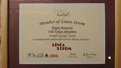 a framed picture of a menu for a restaurant at Eleni Rooms in Rhodes Town