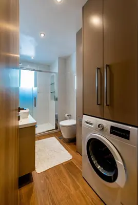 a bathroom with a washing machine in a bathroom at CASA DI RODINI in Rhodes Town