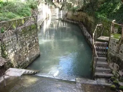 a pool of water with stairs in a canal at CASA DI RODINI in Rhodes Town