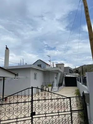 a view of a house from a balcony at Kasteli Cozy House in Archangelos