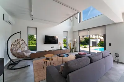 a living room with a couch and a table at Villa Incerto in Ialyssos