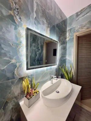 a bathroom with a sink and a mirror at Odysseia Stay Pool & Private Jacuzzi 2min Beach in Kremasti