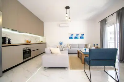 a living room with a couch and a table at Fileo Family and Friends Living in Archangelos