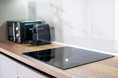 a kitchen counter with a coffee maker and a toaster at Fileo Family and Friends Living in Archangelos