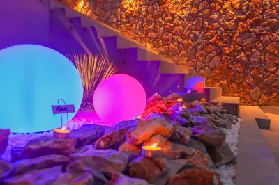 a room with purple and blue lights and rocks at City Compass Luxury Villa in Faliraki