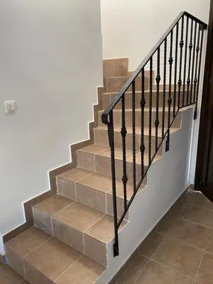 a set of stairs with a black metal railing at Casa Christiana, Lardos in Lardos