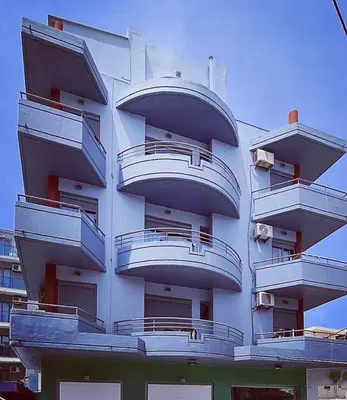 a building with balconies on the side of it at Primordial Apartment in Rhodes Town