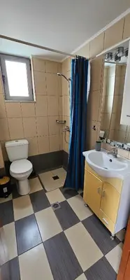 a bathroom with a toilet and a sink and a shower at Primordial Apartment in Rhodes Town