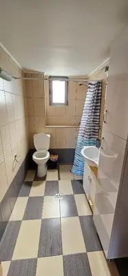 a bathroom with a toilet and a sink at Primordial Apartment in Rhodes Town