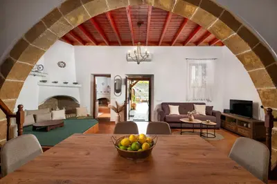 a living room with a table with a bowl of fruit at La casa di Fina in Archangelos