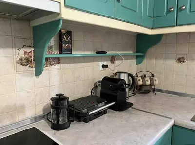 a kitchen with a counter top with a toaster on a stove at Kostas Village House in Psinthos