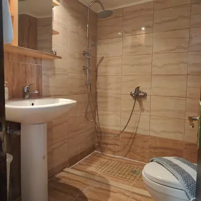 a bathroom with a shower and a sink and a toilet at Casa di Rena Private House with Sunset View in Kritinía