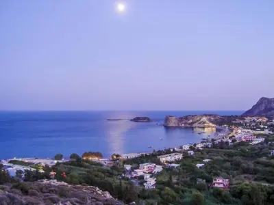 a view of a beach with houses and the ocean at Pasithea Luxury house in Archangelos