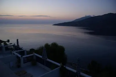 a view of a large body of water at sunset at Annas Studios in Livadia