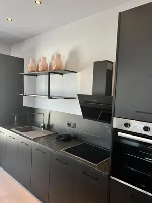 a kitchen with a stove top oven next to a sink at Cora May Central Villa with private pool 200m to the beach in Faliraki