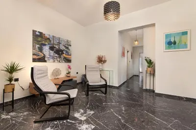 an office with two chairs and a table in a room at Adelais Luxury City Apartment Rhodes in Rhodes Town