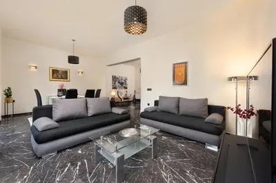 a living room with two couches and a table at Adelais Luxury City Apartment Rhodes in Rhodes Town