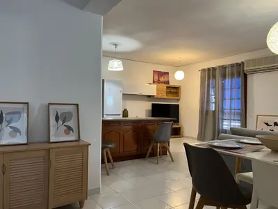 a kitchen and living room with a table and chairs at Johannes House in Afantou