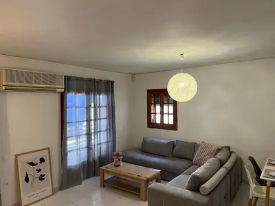 a living room with a couch and a table at Johannes House in Afantou