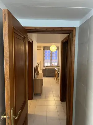 a hallway with a door leading to a living room at Johannes House in Afantou