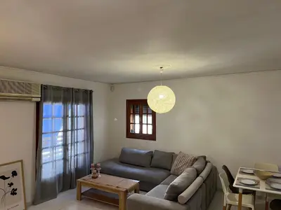 a living room with a couch and a table at Johannes House in Afantou