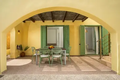 a dining room with a table and chairs at Villa Asteria in Gennadi