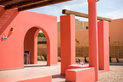 a patio with orange columns and an archway at Villa Selene in Gennadi