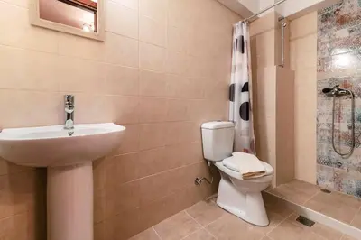 a bathroom with a sink and a toilet and a shower at Kristinas View Studios in Rhodes Town