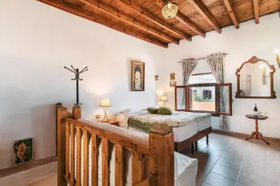a bedroom with a large bed in a room at Kristinas View Studios in Rhodes Town