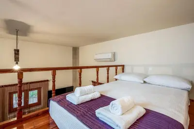 a bedroom with two beds with towels on them at Alchadef Park Apartment in Rhodes Town