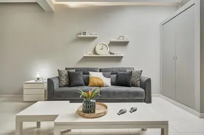 a living room with a couch and a table at Old Town Luxury Velvet Apartment in Rhodes Town