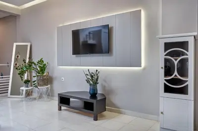 a living room with a tv on a wall at Old Town Luxury Velvet Apartment in Rhodes Town
