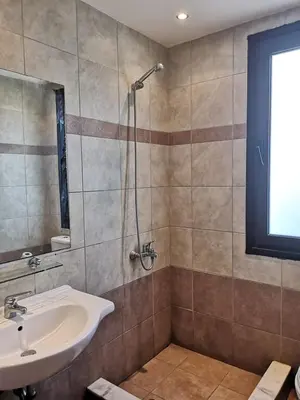 a bathroom with a sink and a shower at 3 Bed Villa In Lardos Village in Lardos