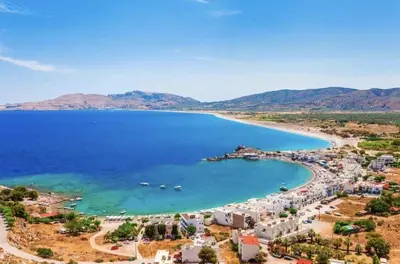 an aerial view of a beach with blue water at Haraki Sunset Apartment in Haraki