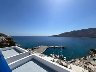 a view of a body of water with a dock at Marinas Studios in Livadia