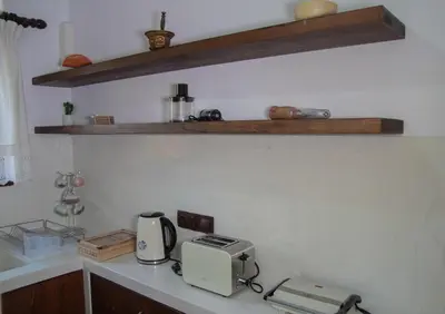 a kitchen counter with a toaster and a printer on it at Villa Nefeli Rhodes in Archangelos