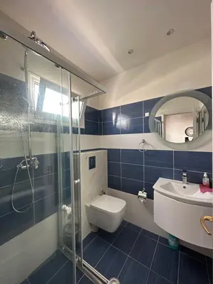 a bathroom with a toilet and a sink and a shower at Jz boutique 1 in Rhodes Town