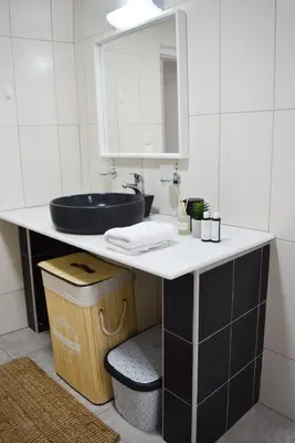 a bathroom with a sink and a mirror at Ixia Manor House in Ixia