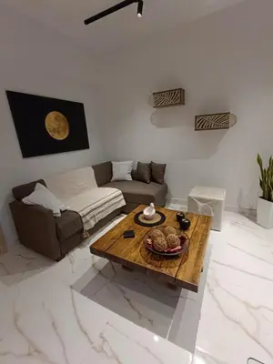 a living room with a coffee table and a couch at Seven Palms Central in Rhodes Town