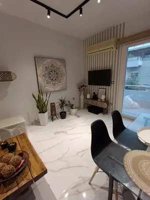a living room with a large marble floor at Seven Palms Central in Rhodes Town